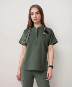 Model wearing an olive button-neck scrub top with stethoscope